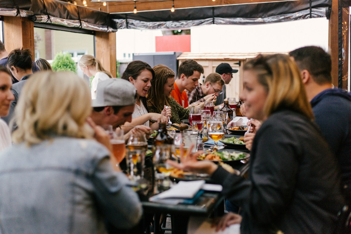 Friends sharing a meal and conversation around a table